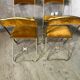 Quatre chaises pliantes velours et laiton