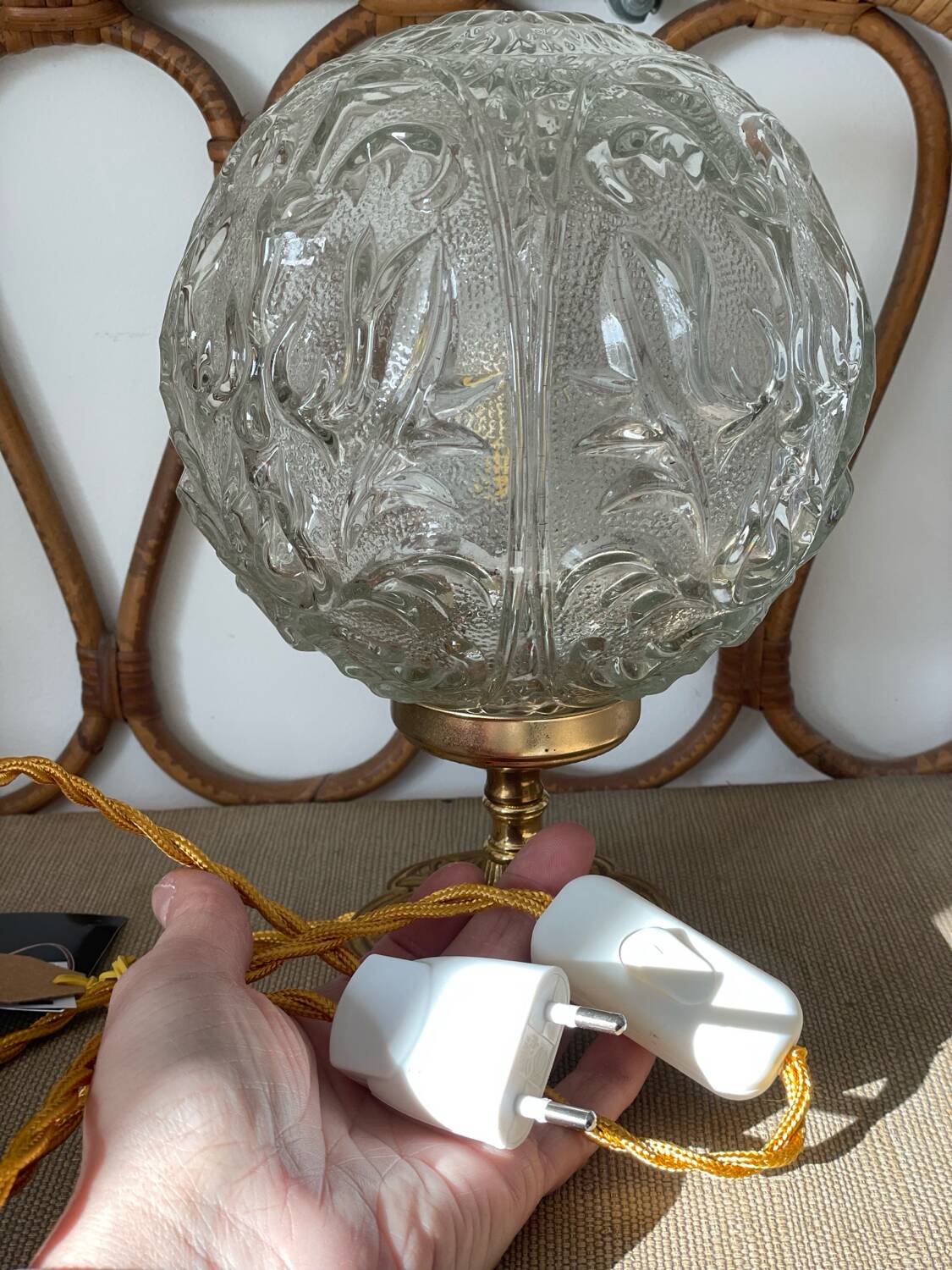 Textured round globe table lamp with a gold brass base