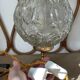 Textured round globe table lamp with a gold brass base