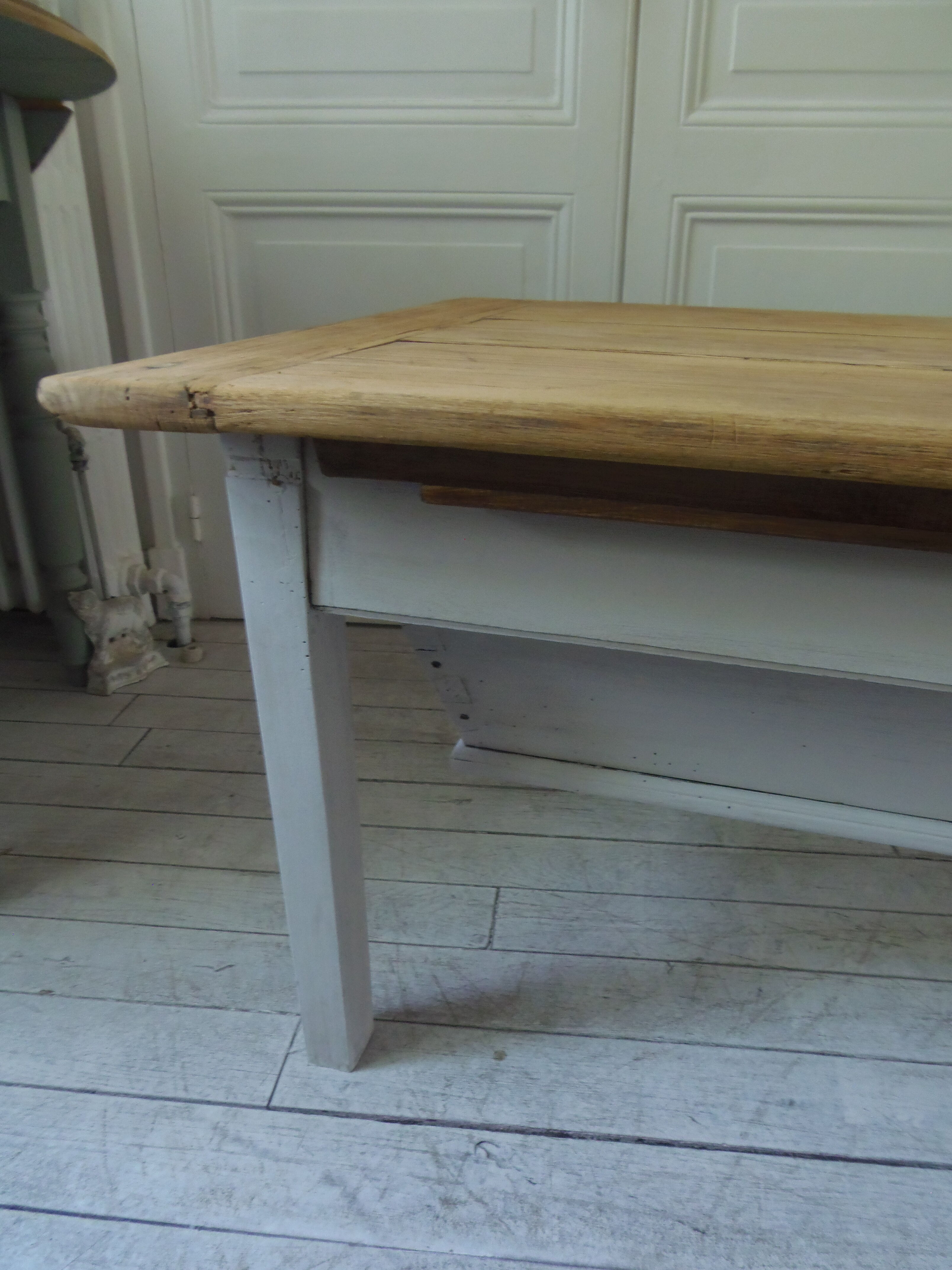 Coffee table made from an authentic farmhouse table, leg patinated pearl gray