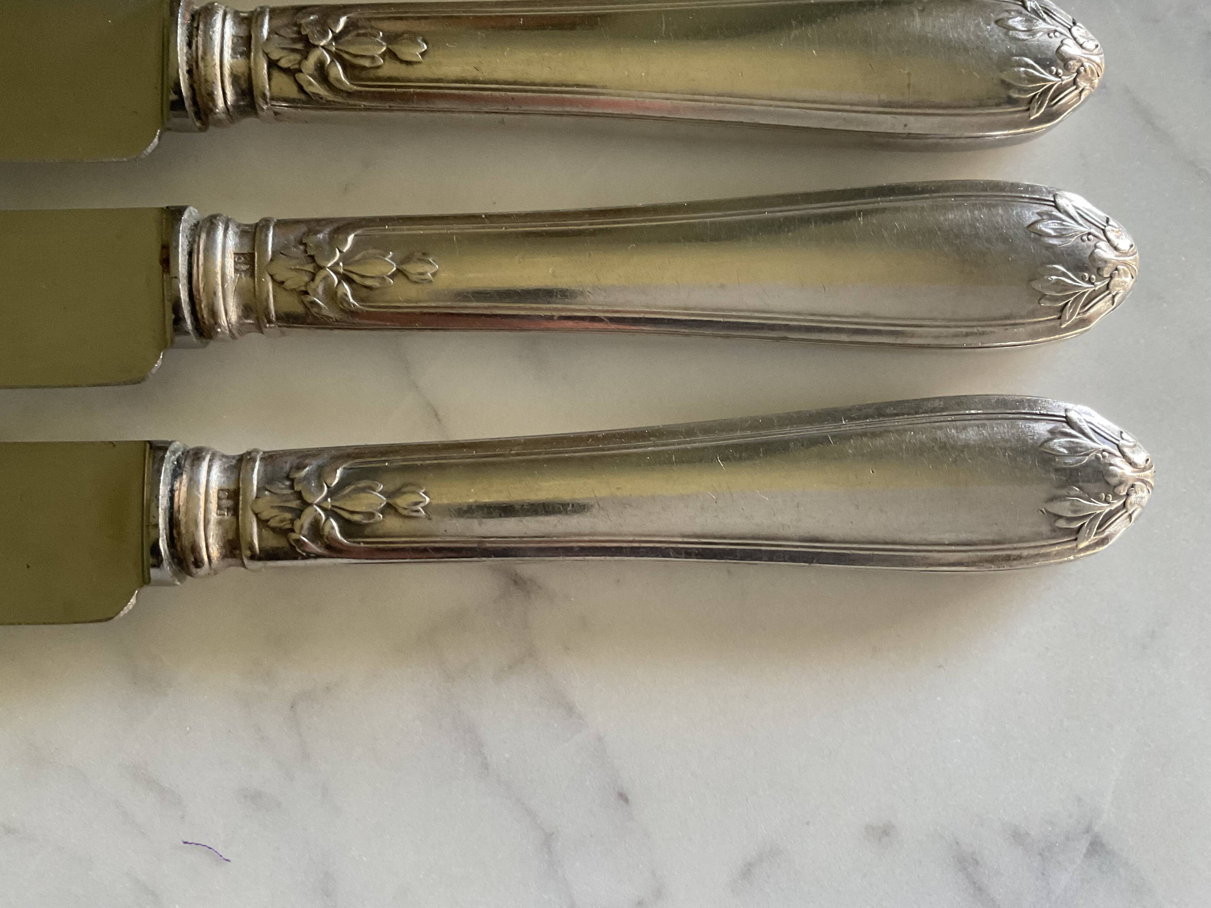 12 silver-plated metal knives. levert silversmith