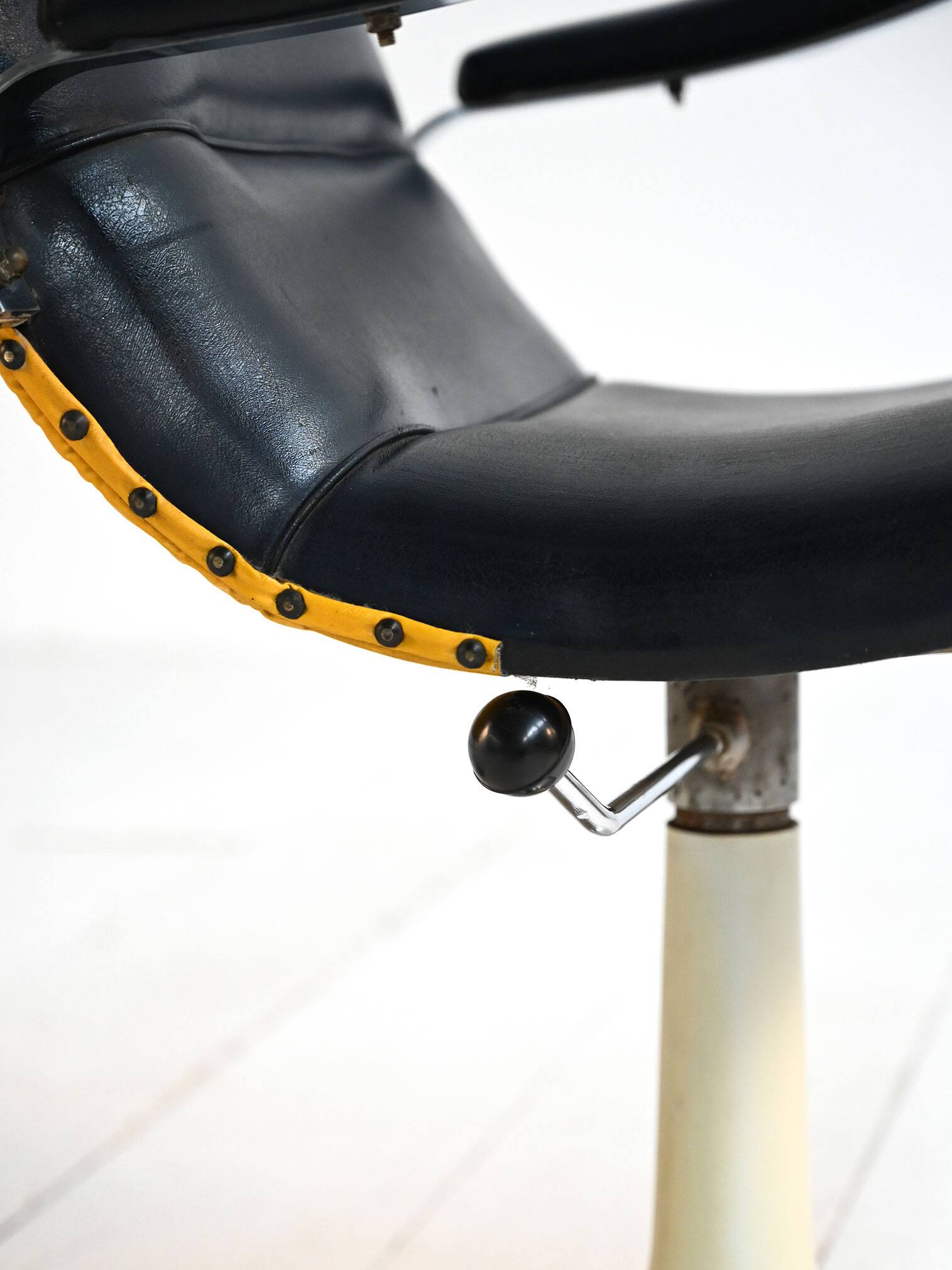 Pair of European 1970s swivel armchairs in faux leather and steel