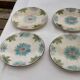 Lot de 4 assiettes en barbotine début XXème
