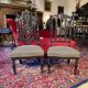 Fake pair of low Napoleon III chairs in blackened wood.