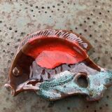 Empty pocket in glazed ceramic slip in the shape of vintage fish