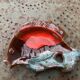 Empty pocket in glazed ceramic slip in the shape of vintage fish