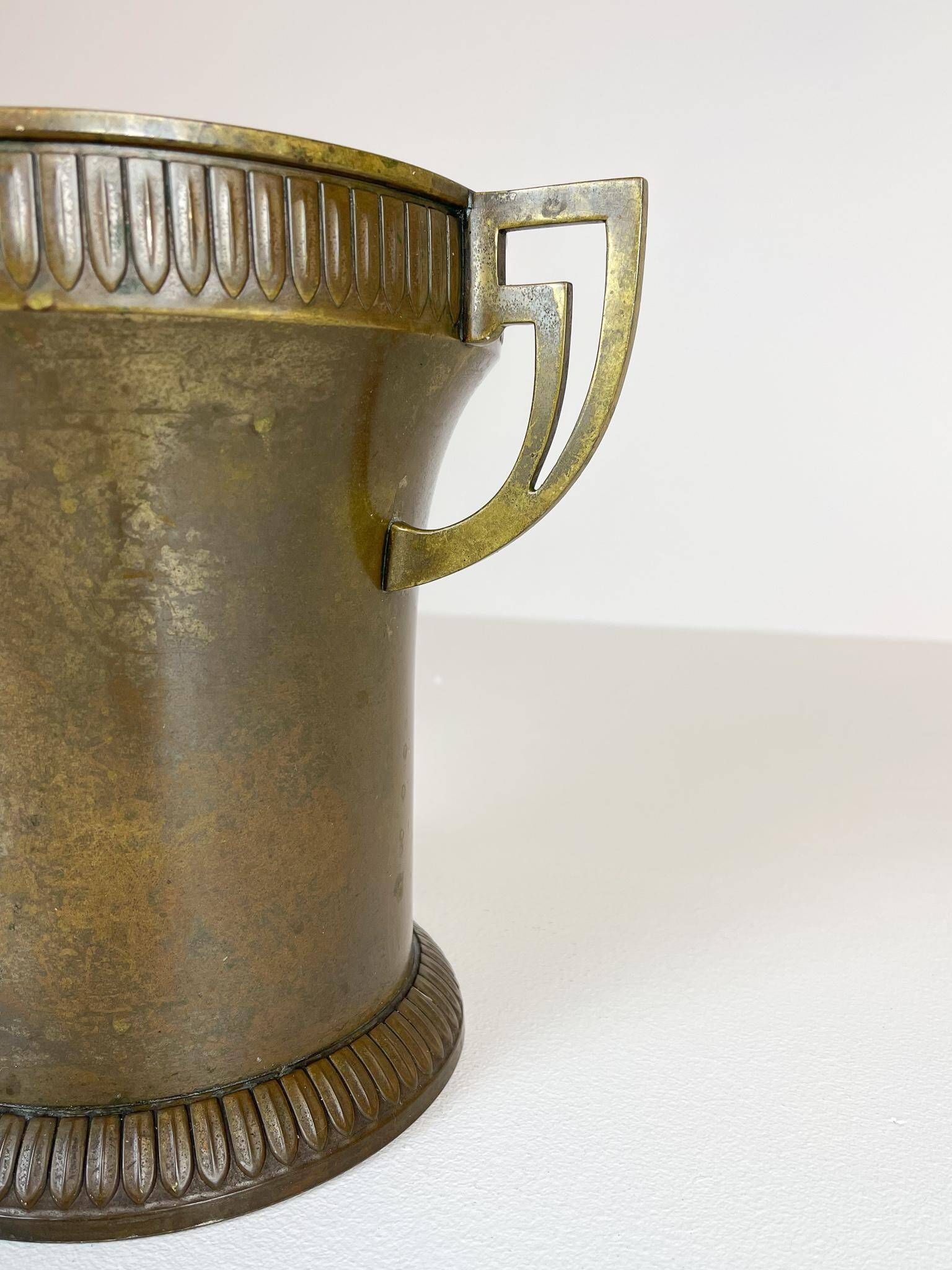 Art Deco champagne cooler in copper and brass with relief patterns, Sweden, 1930s.
