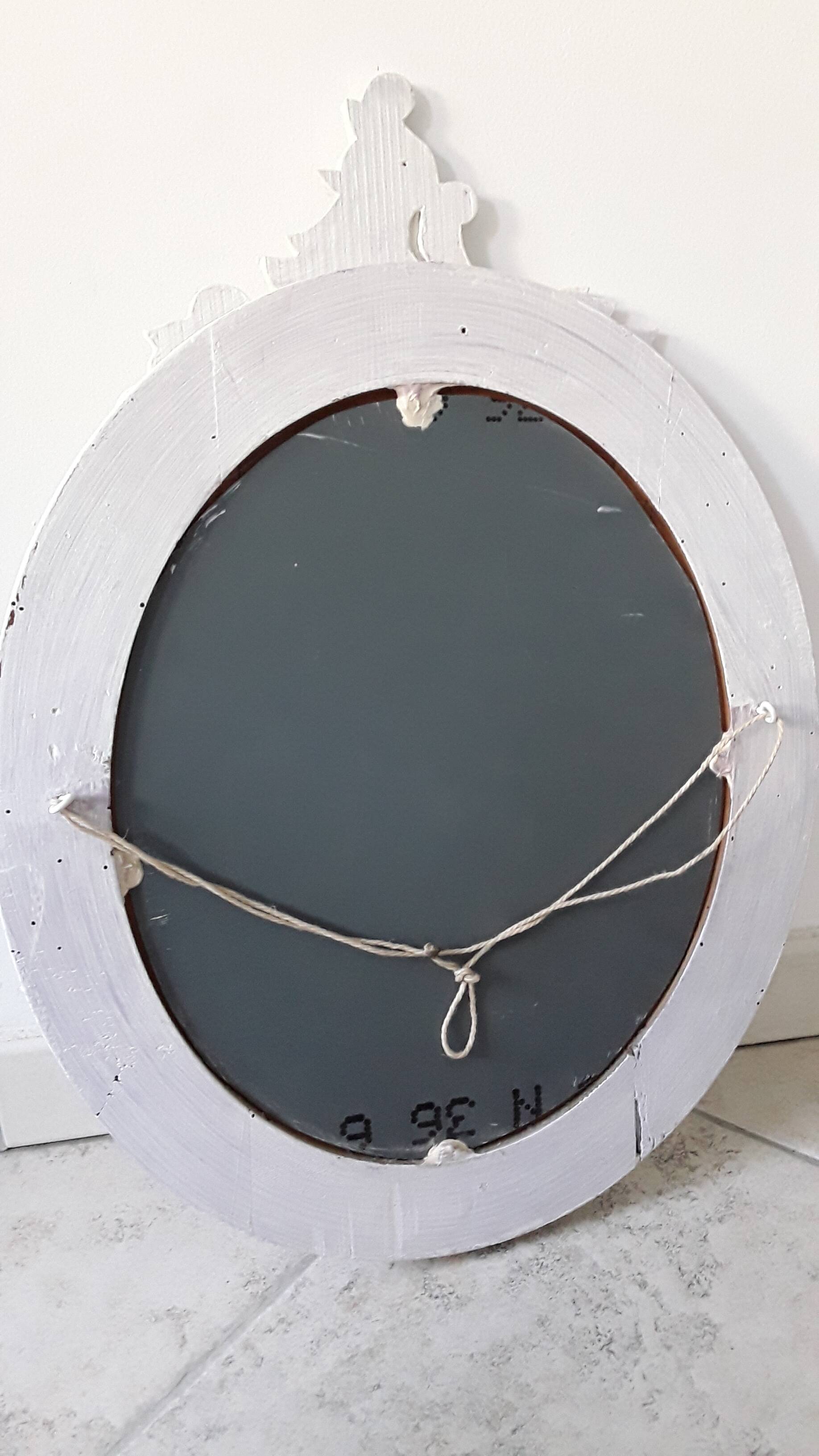 Antique oval mirror in painted wood