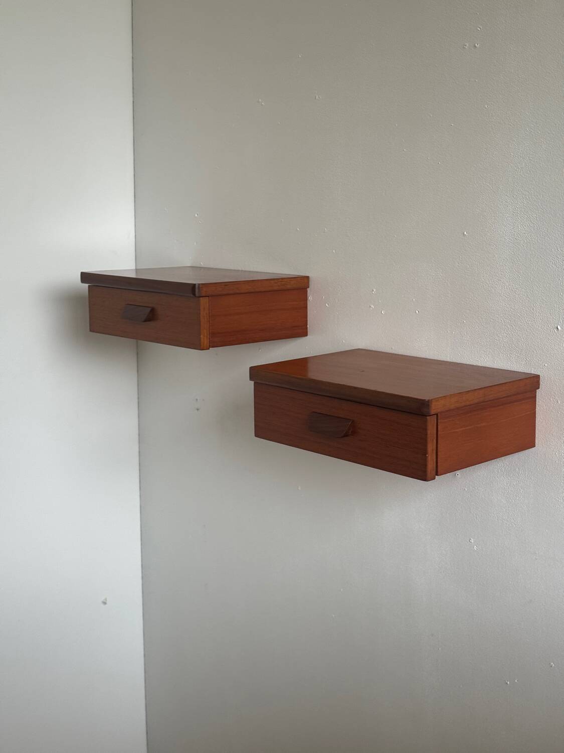 Vintage Scandinavian teak wall-mounted bedside tables.