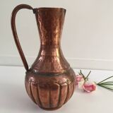 Pitcher-shaped vase in hammered copper