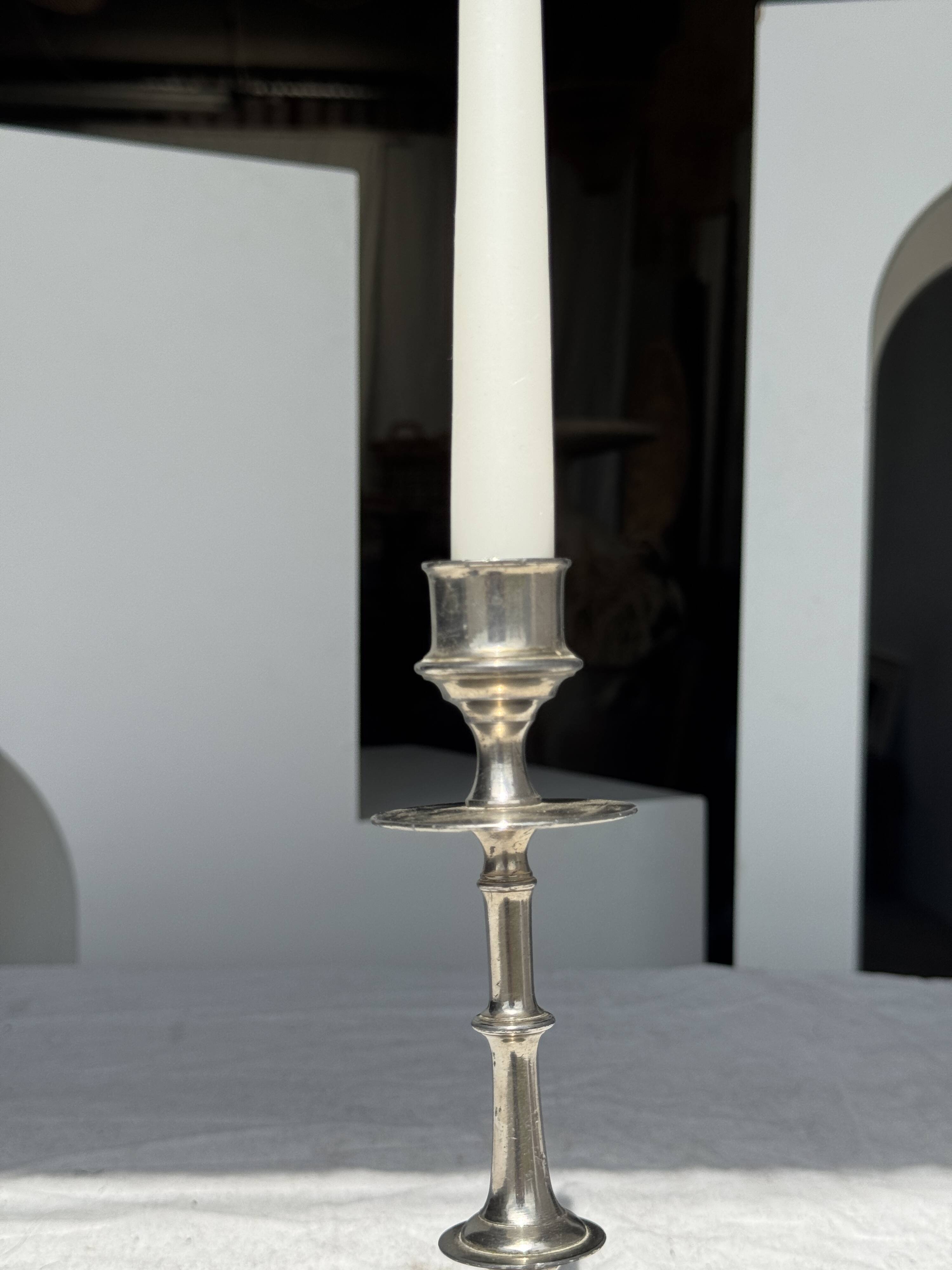A large silver candlestick holder H23