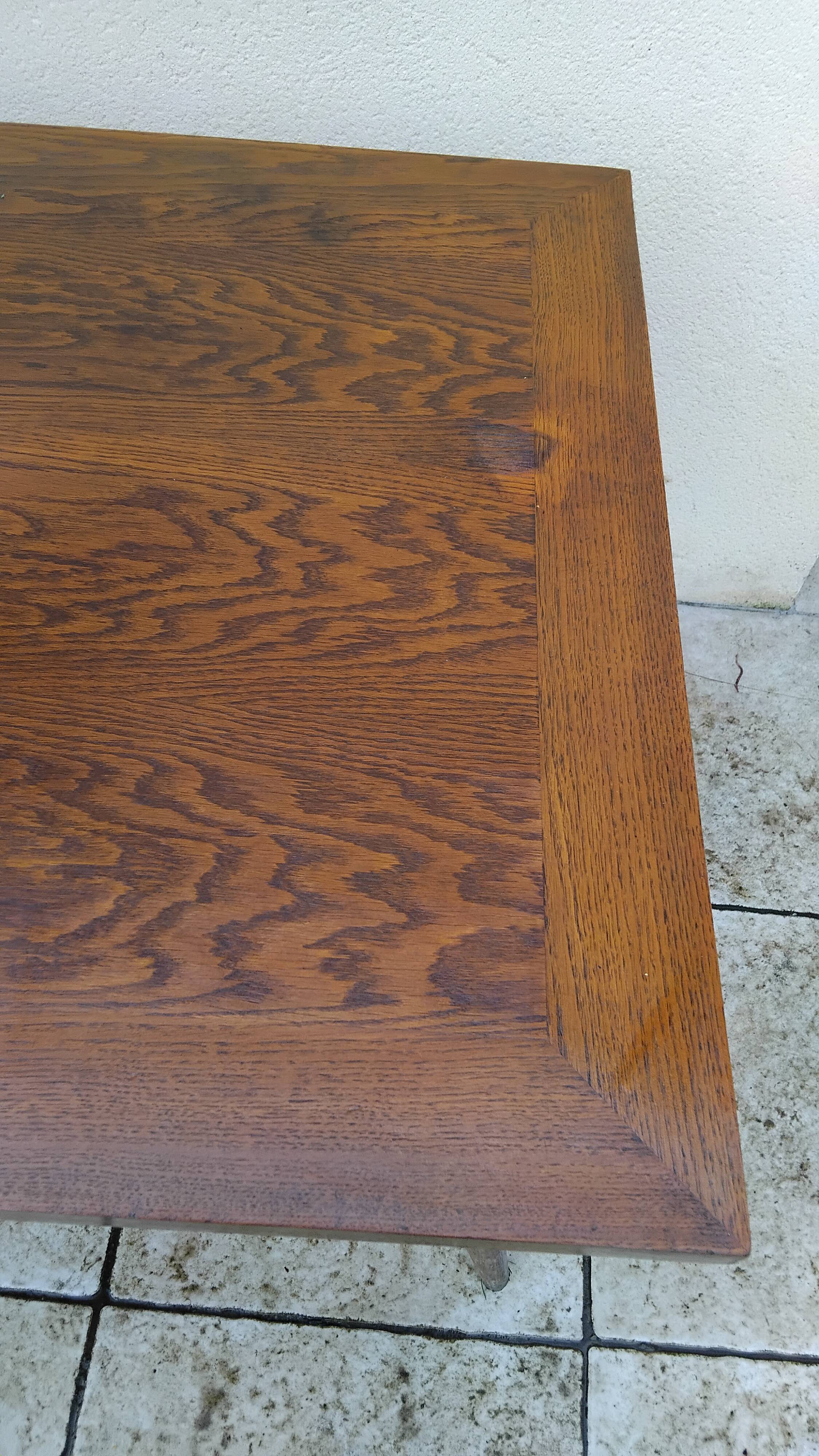 Vintage oak table with tapered legs.