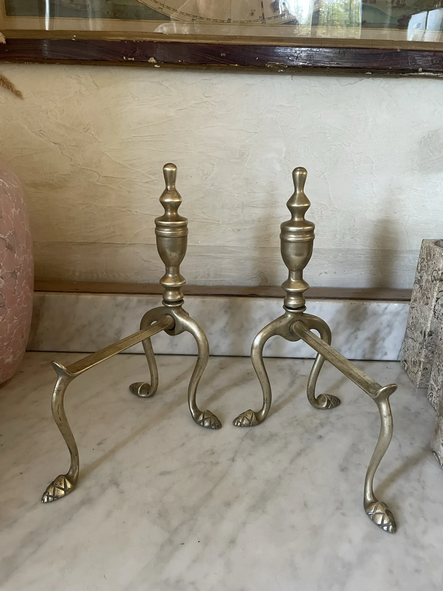 Pair of Victorian brass fire dogs from the late 19th century.