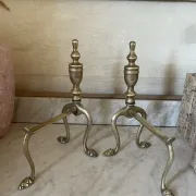Pair of Victorian brass fire dogs from the late 19th century.