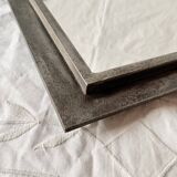 Vintage wall mirror in varnished steel decorated with a rose in relief