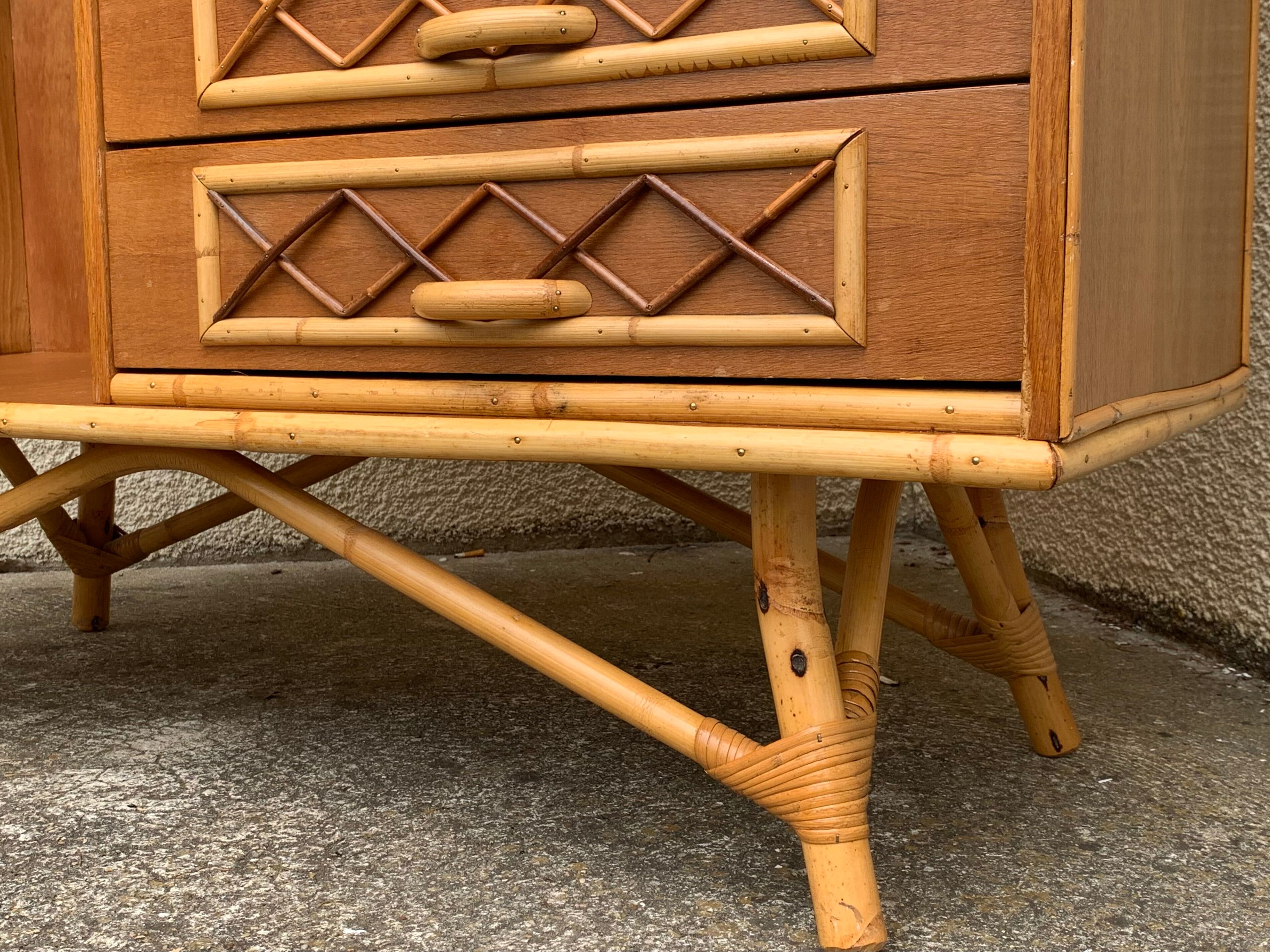 Rattan wardrobe with tapered legs from the 1960s.