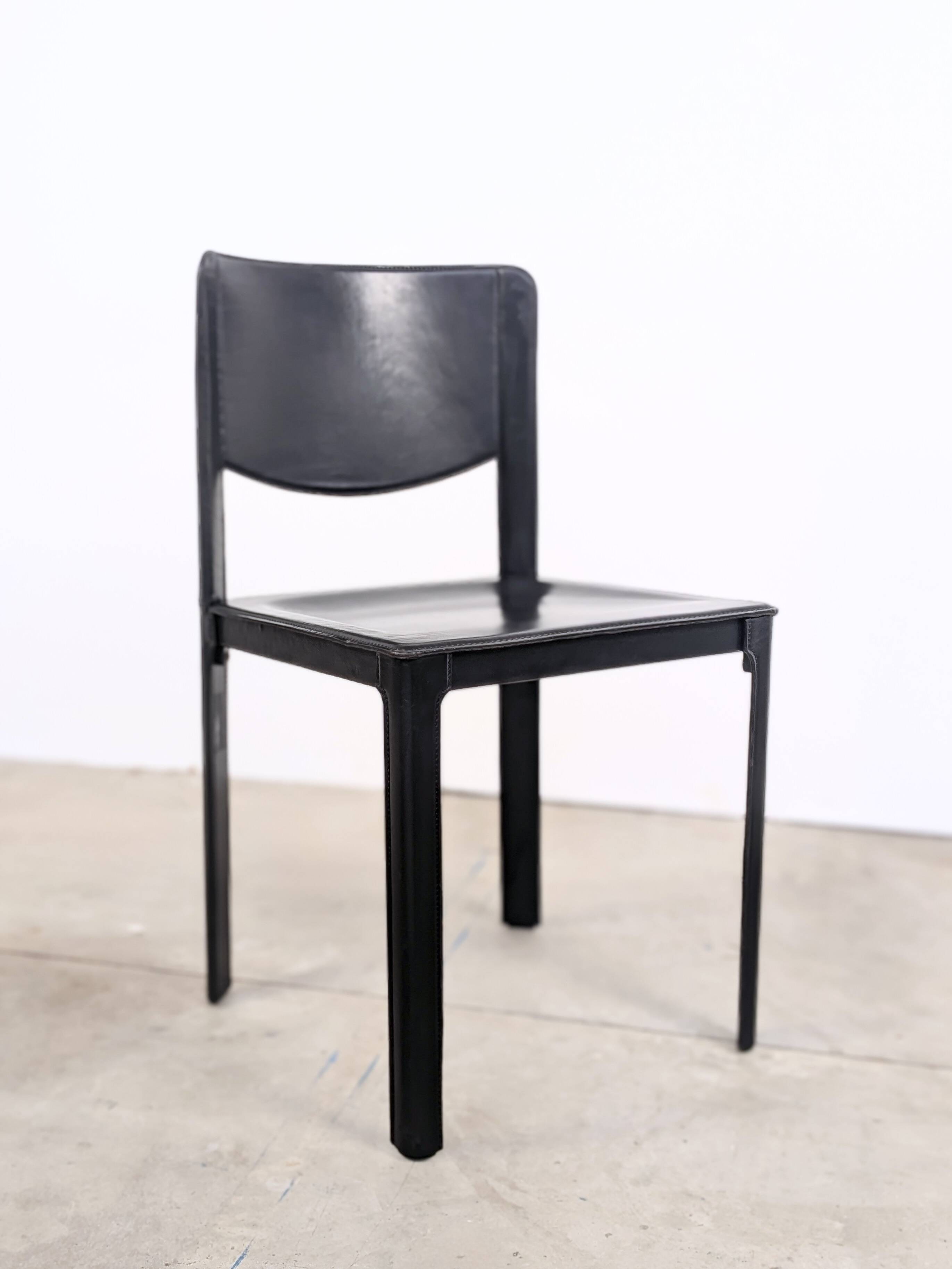 Pair of Matteo Grassi chairs in black saddle leather, 1980s.