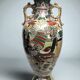 Japan, Satsuma vase with richly decorated handles, signed, early 20th century