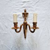 French Empire-style wall sconce or chandelier in bronze with an antique gold patina.