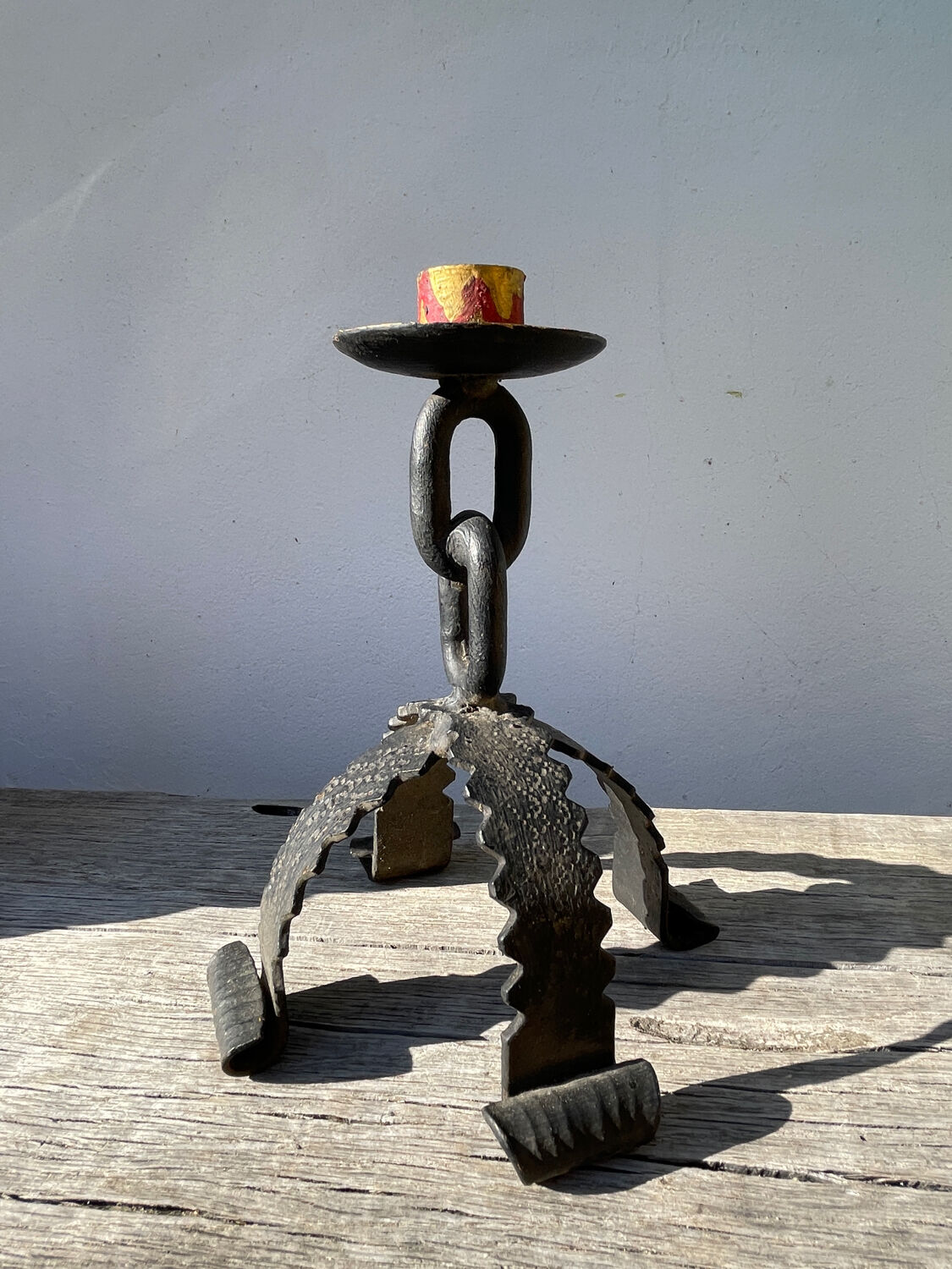 Pair of candlesticks with wrought iron chain