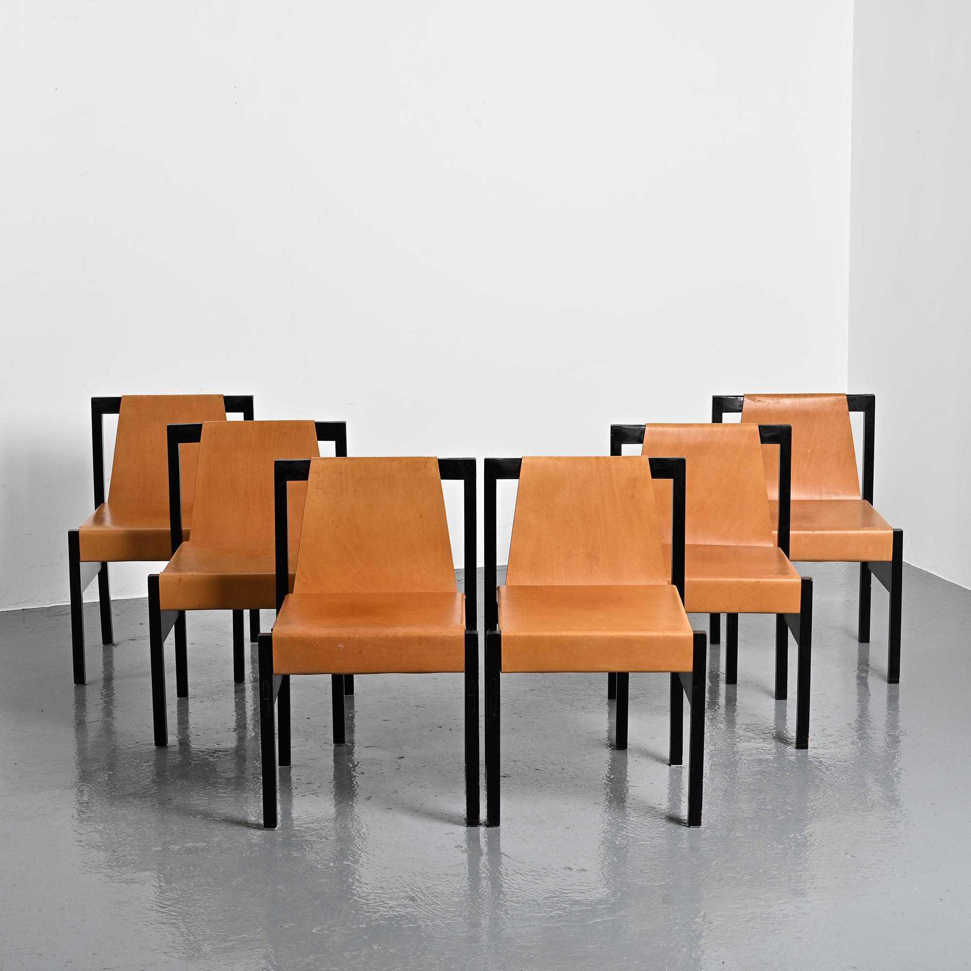 Set of black lacquered wooden chairs with leather, Swiss architect's work, 1980s.