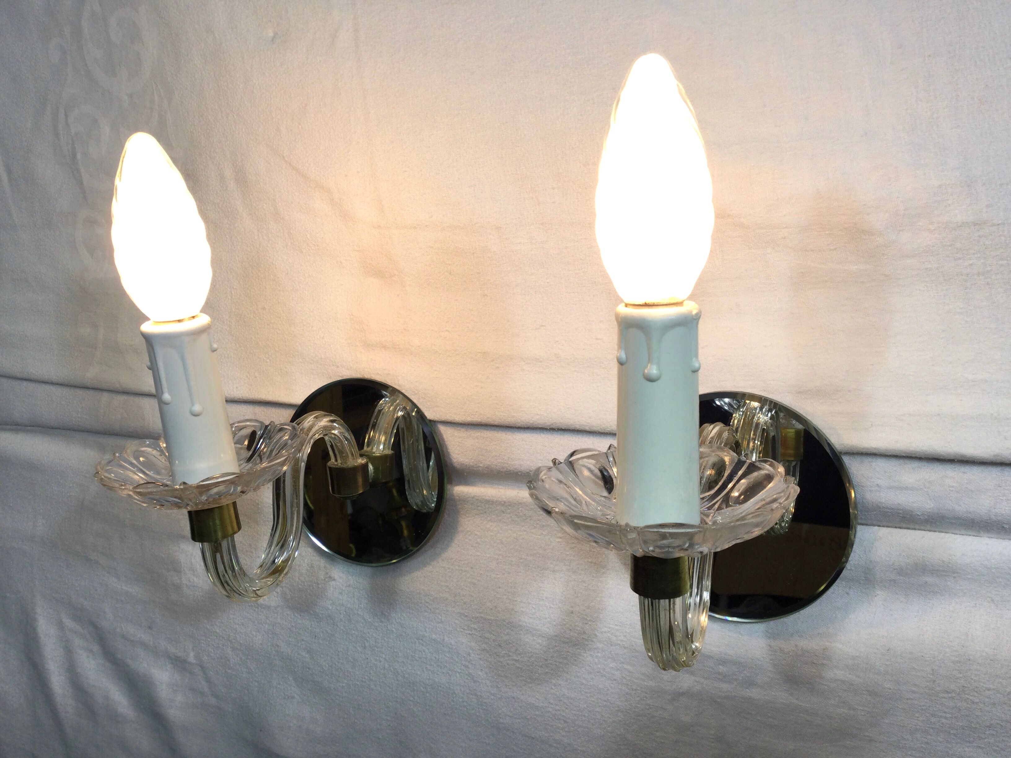 Pair of glass and mirror sconces
