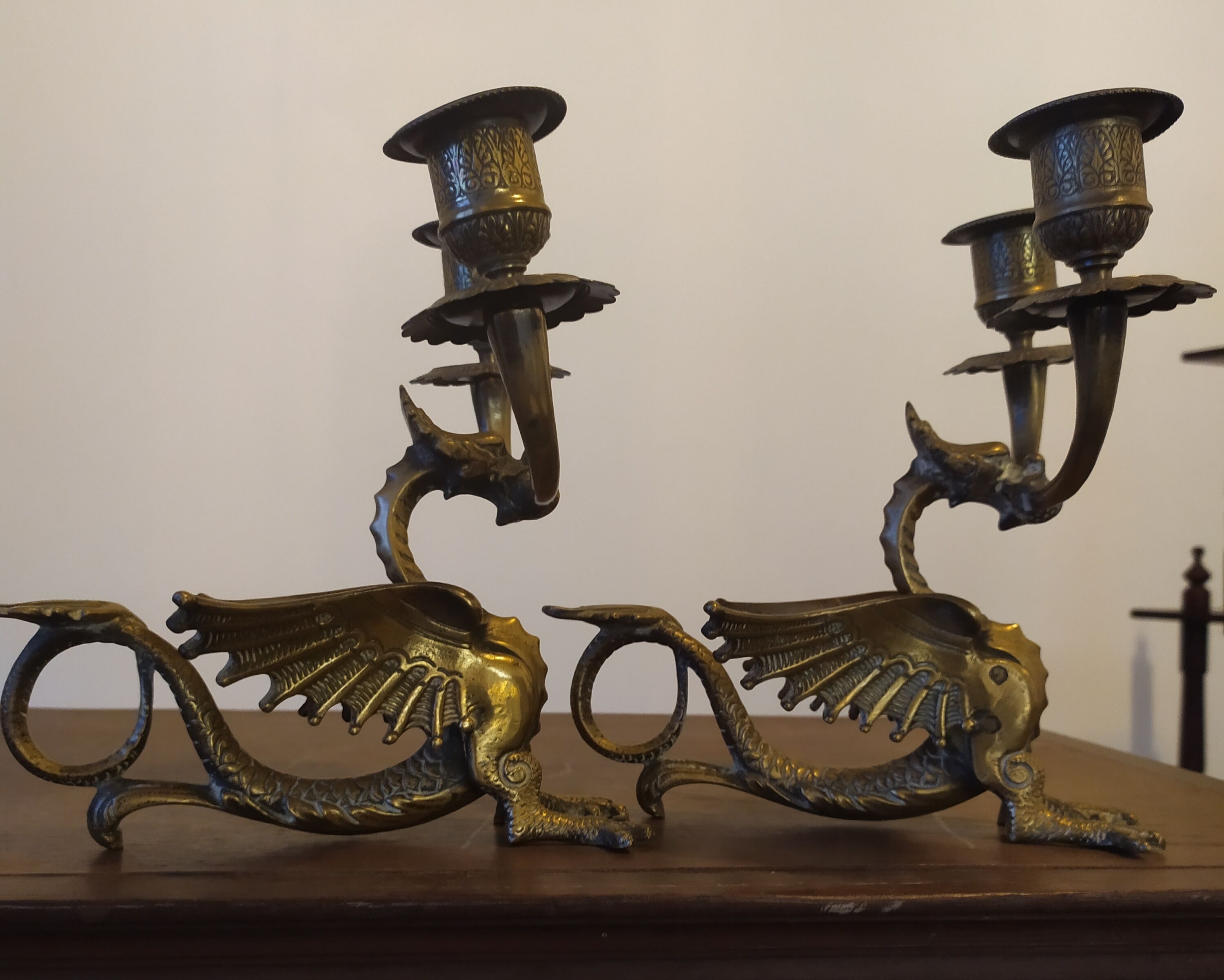 Pair of candlesticks with old chimera dragons hands