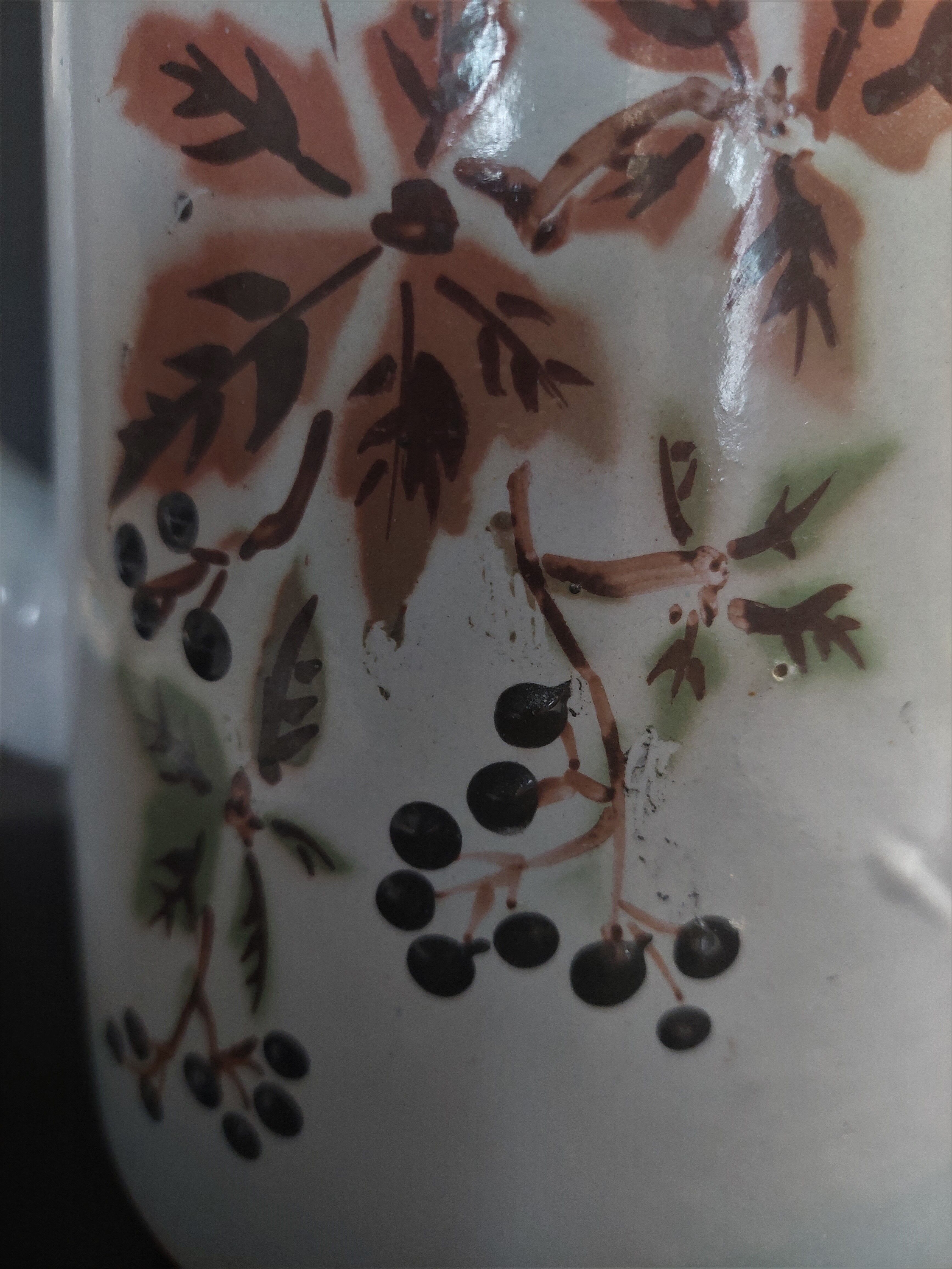 Enamelled sheet metal pourer decorated with black berries early twentieth century