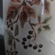 Enamelled sheet metal pourer decorated with black berries early twentieth century