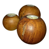 Set of 3 spherical olive wood candle holders in boho style.