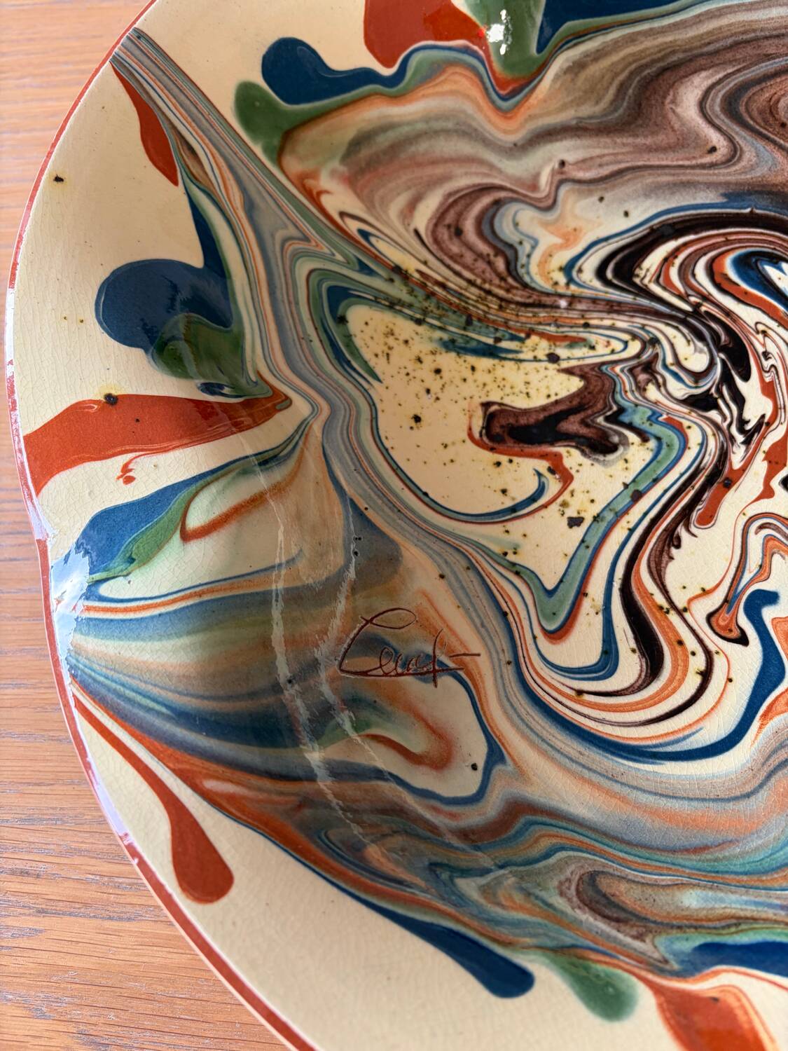 Glazed ceramic plate signed