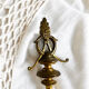 Pair of Empire style candlesticks, patinated brass and black stone.