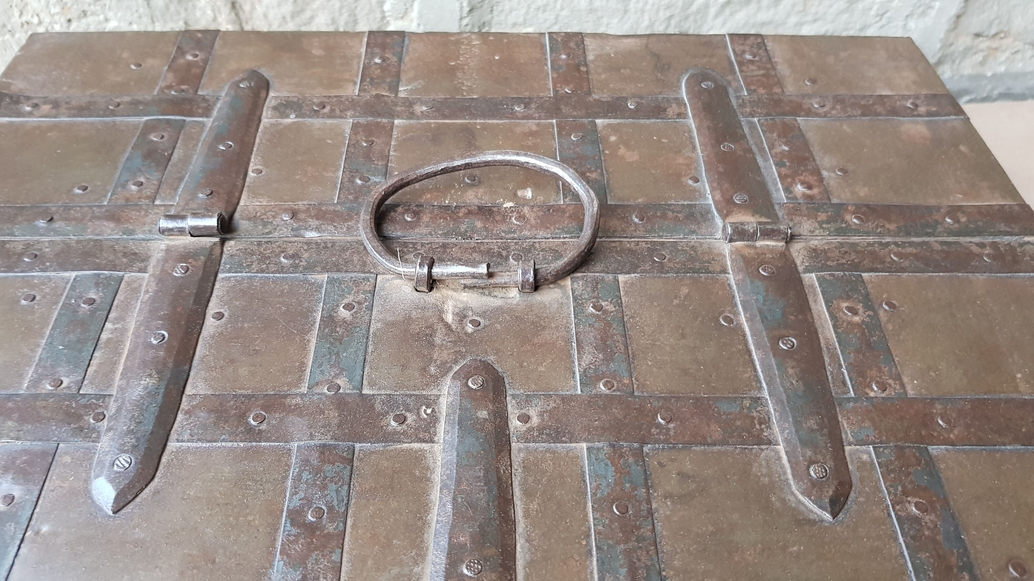 Old tribal chest in hammered metal
