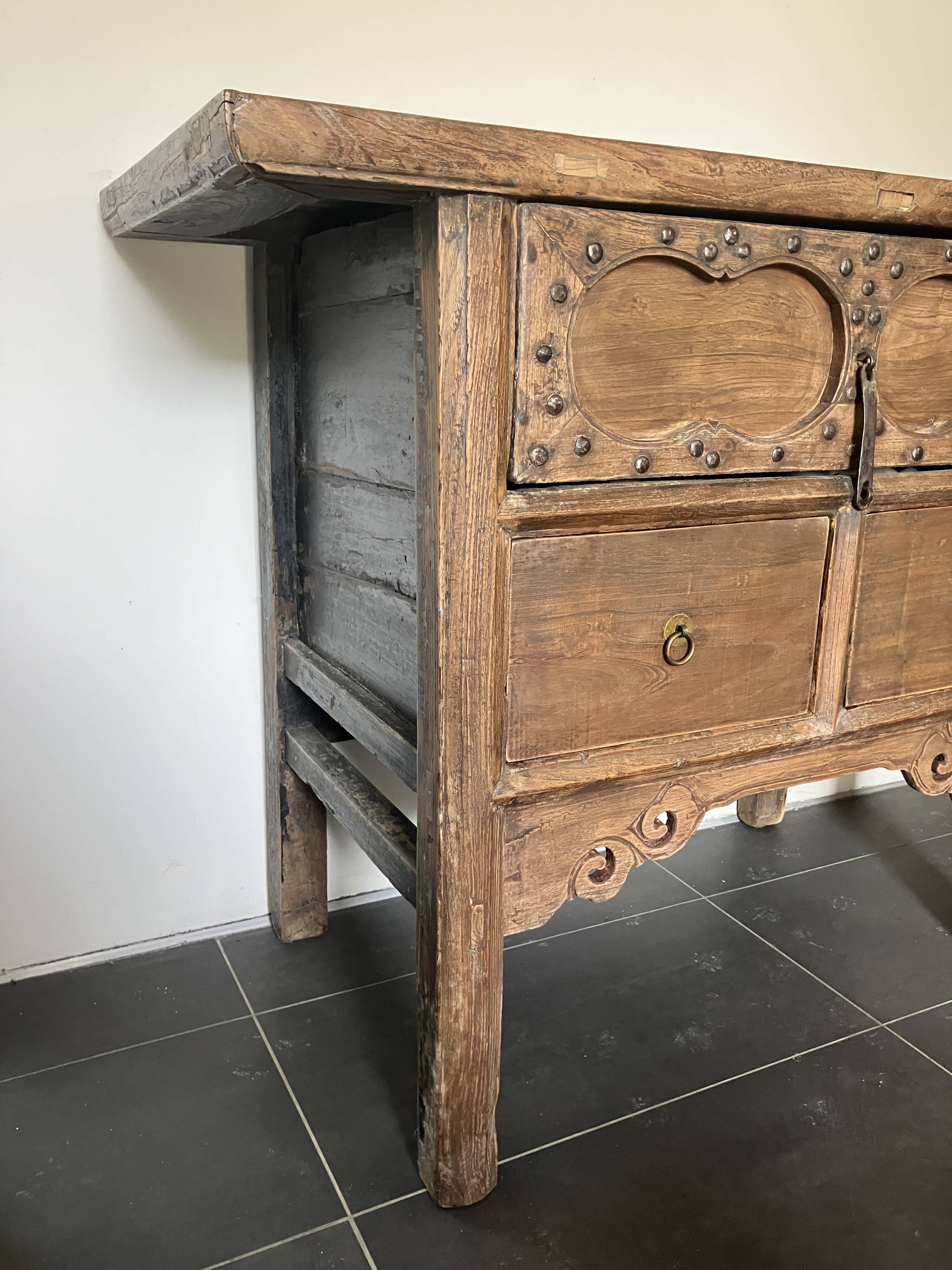 Very old elm wood with carved patterns and ironwork pieces.