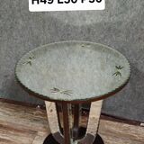 Art Deco guéridon resting on a central base made of stained wood.