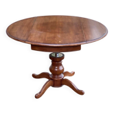 Round dining table, solid wood, central leg, extendable flaps, 20th century.
