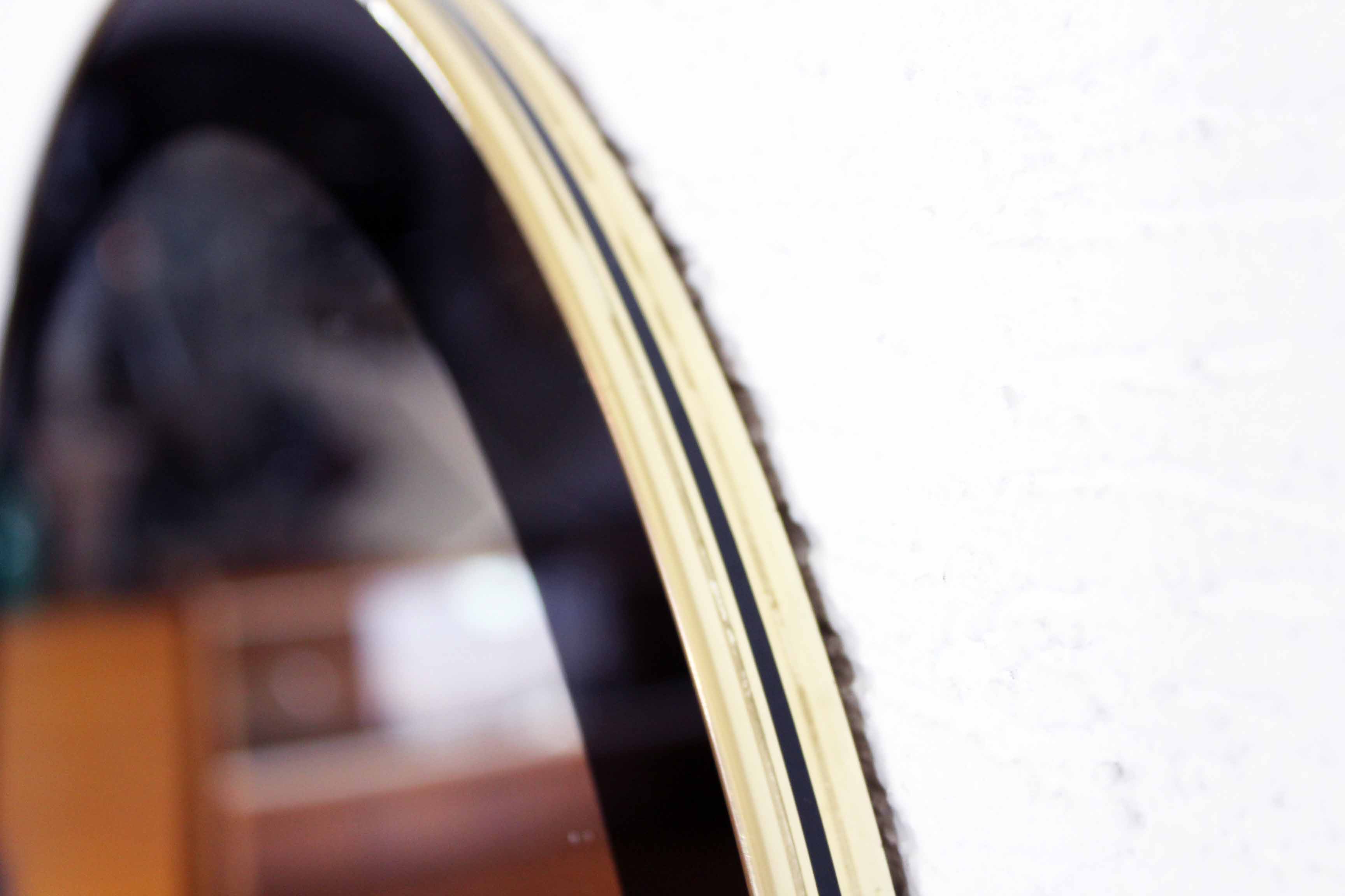 Black and gold 60s round mirror