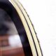 Black and gold 60s round mirror