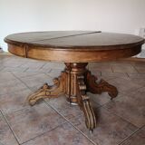 Old table with central leg, small casters, 2 extensions