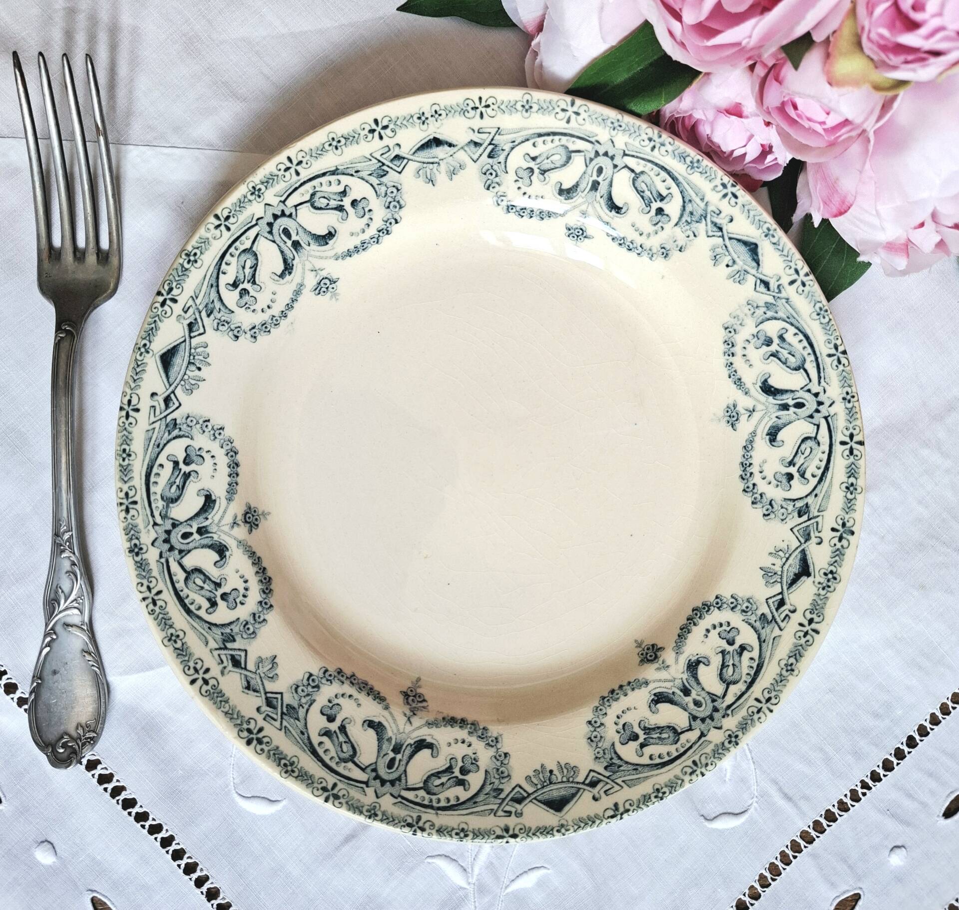 Old mismatched flat plates made of ironstone earthenware.