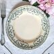 Old mismatched flat plates made of ironstone earthenware.