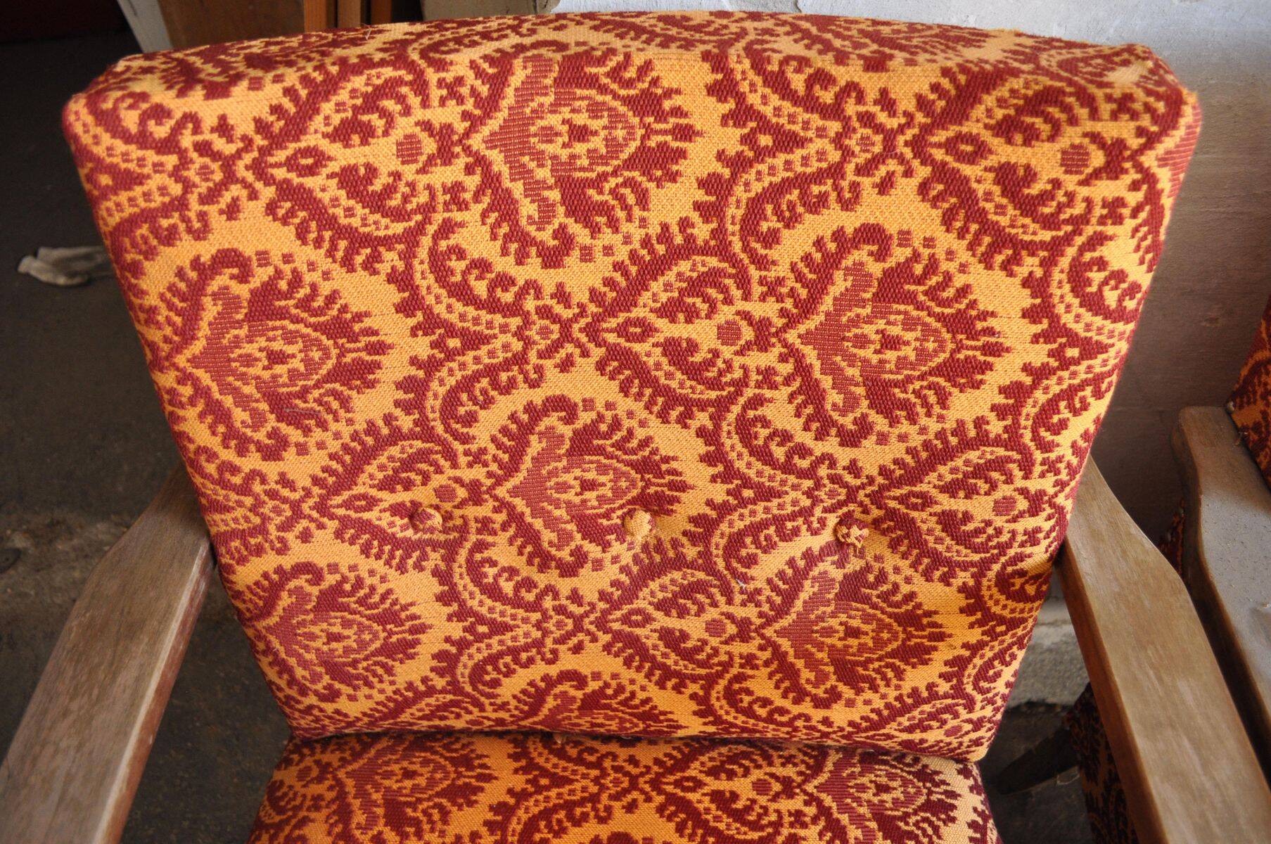 Set of 4 multicoloured mid-century armchairs in fabric and wood, 1950s.