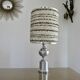 Brushed aluminum and chrome lamp typical of the 70s