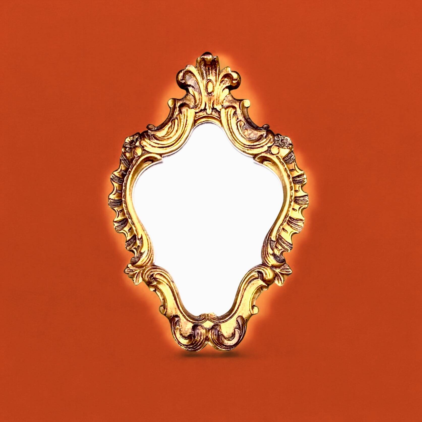 Rococo wall mirror in golden resin