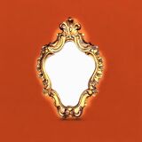 Rococo wall mirror in golden resin