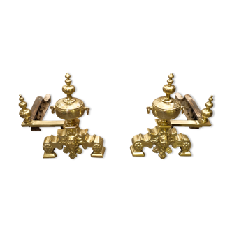 Pair of Louis XIV style chenets in gilded copper with angel head decoration.