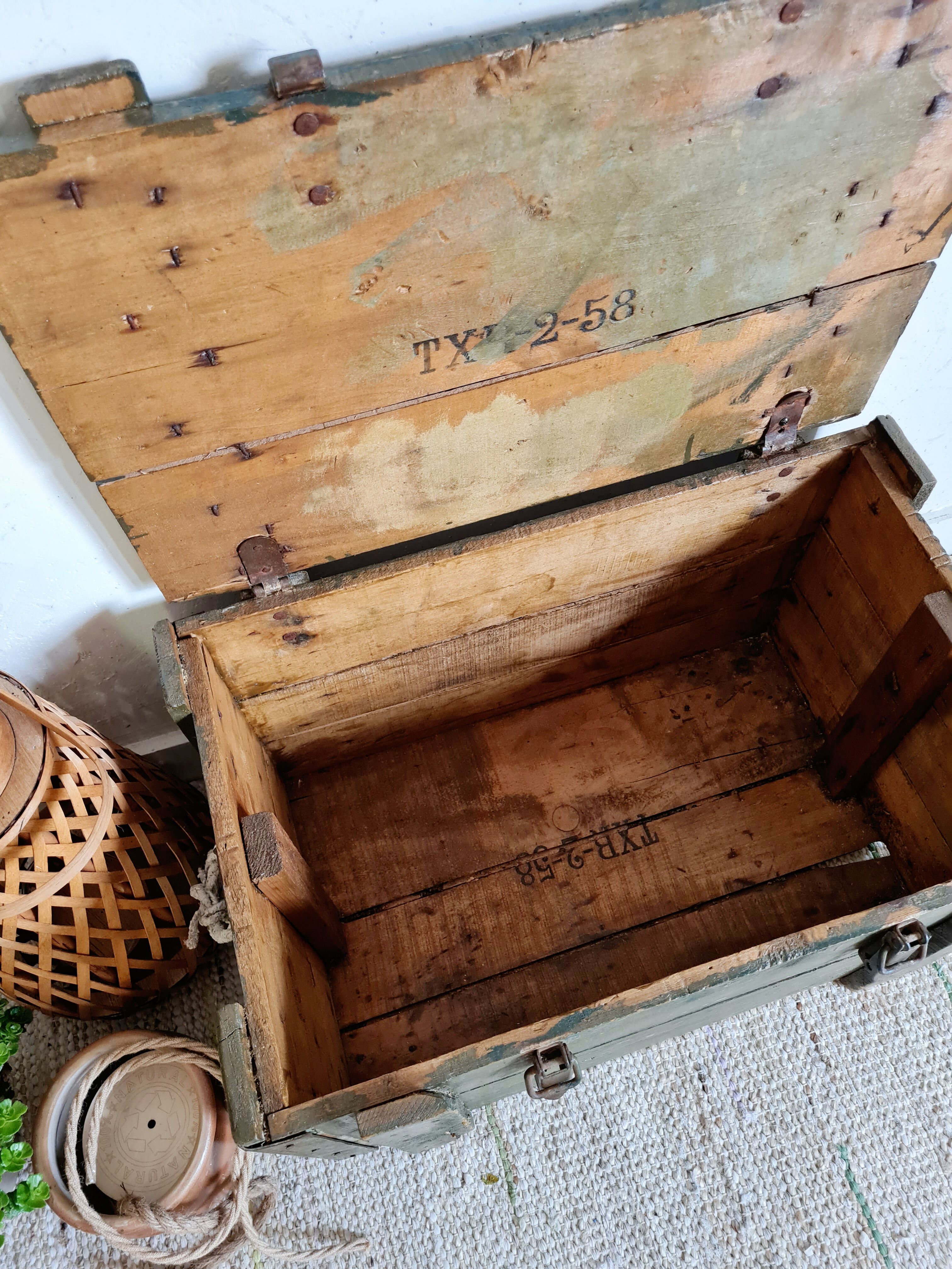 Old green military crate or trunk