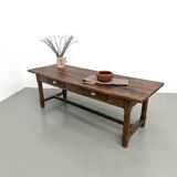 Authentic French farmhouse table from 1890 in solid oak with two drawers.