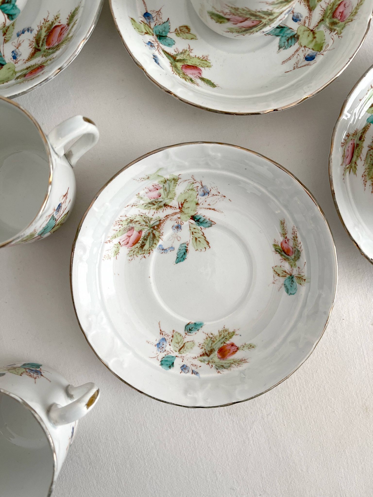 12 ironstone coffee cups with polychrome floral decoration, KG Lunéville