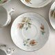 12 ironstone coffee cups with polychrome floral decoration, KG Lunéville